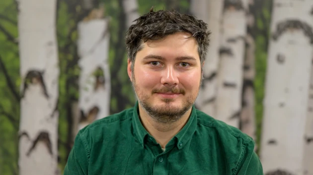 Jérôme in front of a birch tree background