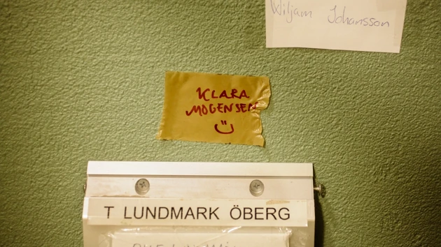 A postbox with a temporary student addressee.